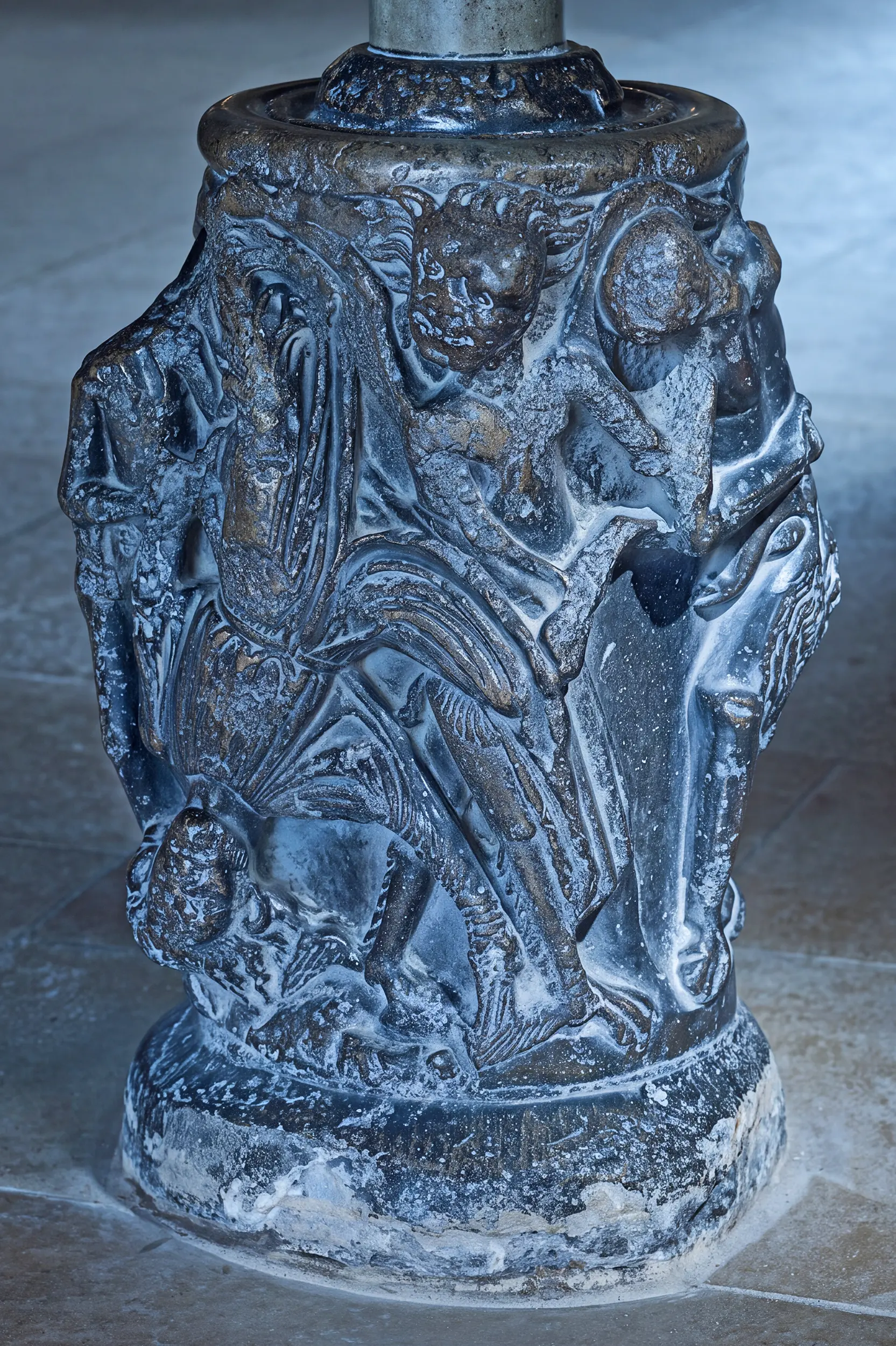 The carved socle at the west doorway of Peterborough Cathedral, traditionally interpreted as the fall of Simon Magus