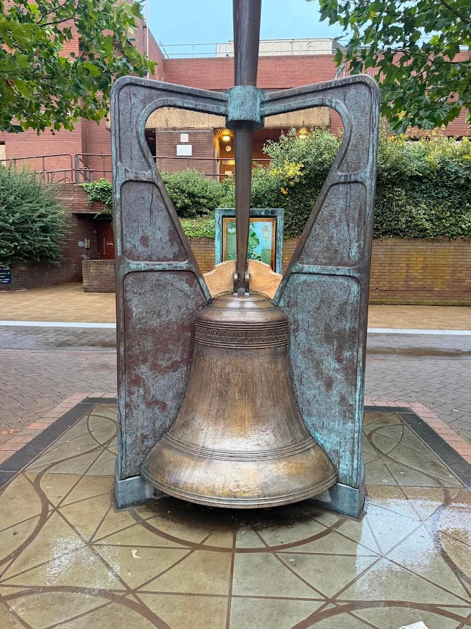Voice of the City Henry Penn bell sculpture on Lower Bridge Street in Peterborough